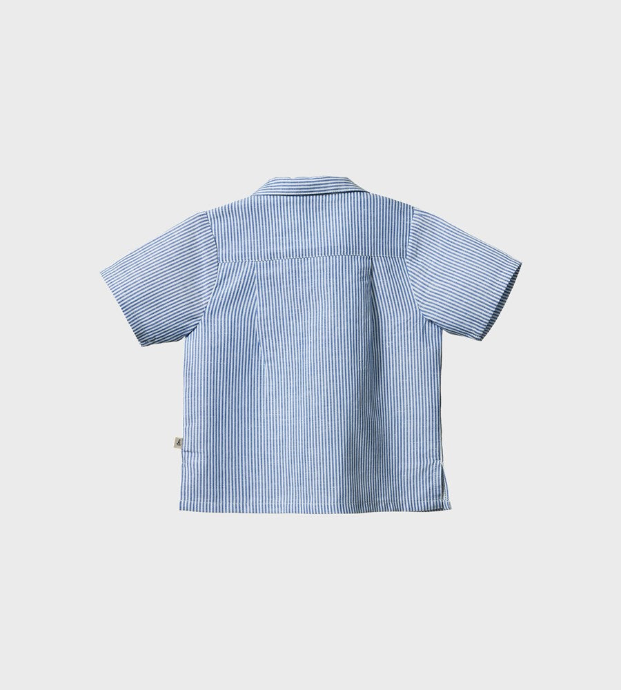 Blue and white striped shirt on a light gray background