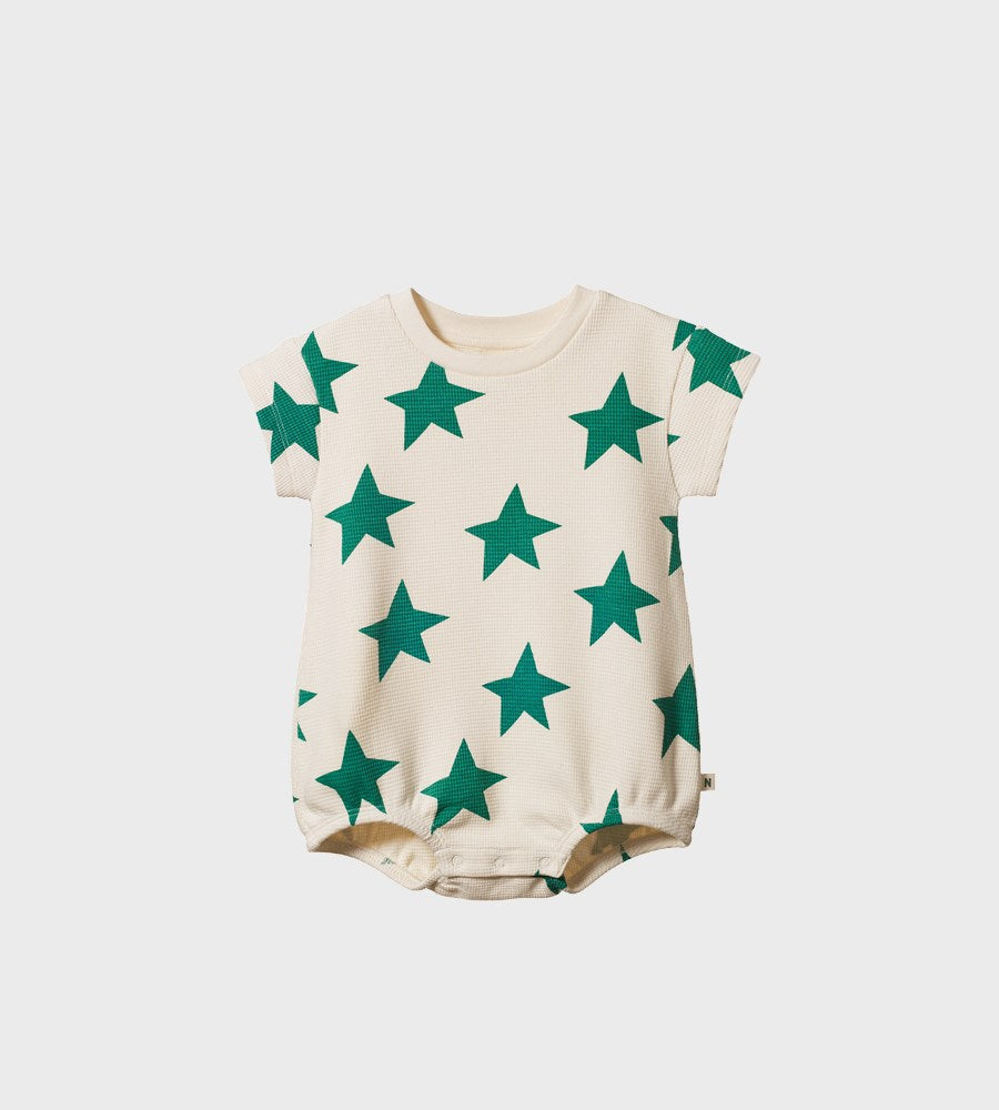 Baby romper with green star pattern on a white background