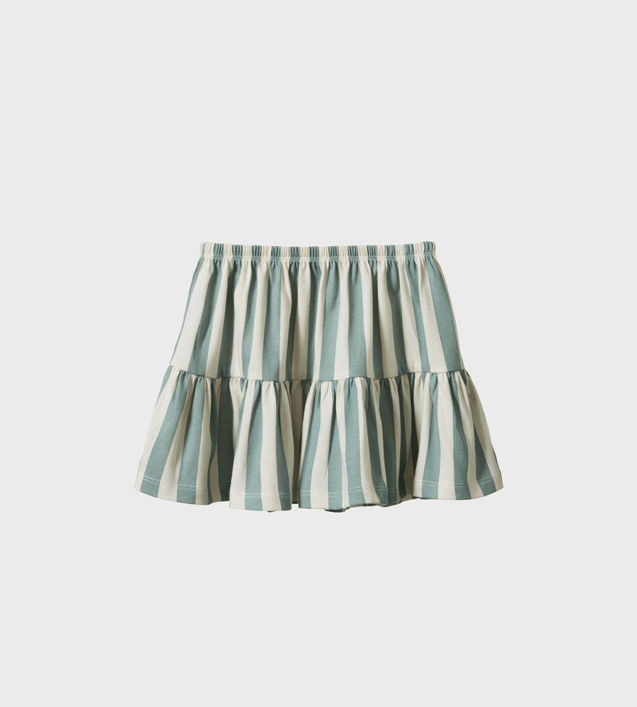 Striped skirt with ruffled layers on a light gray background