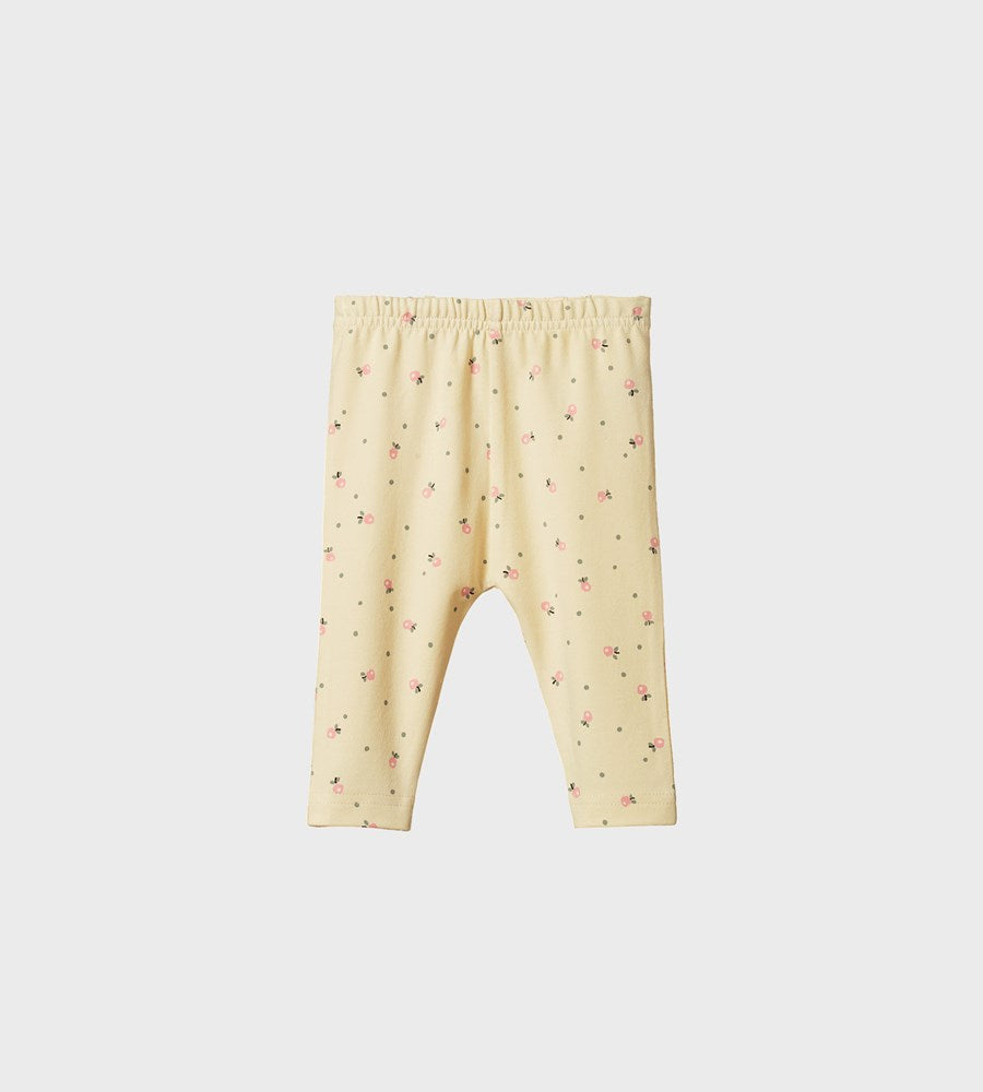 Yellow baby leggings with a subtle pattern on a white background