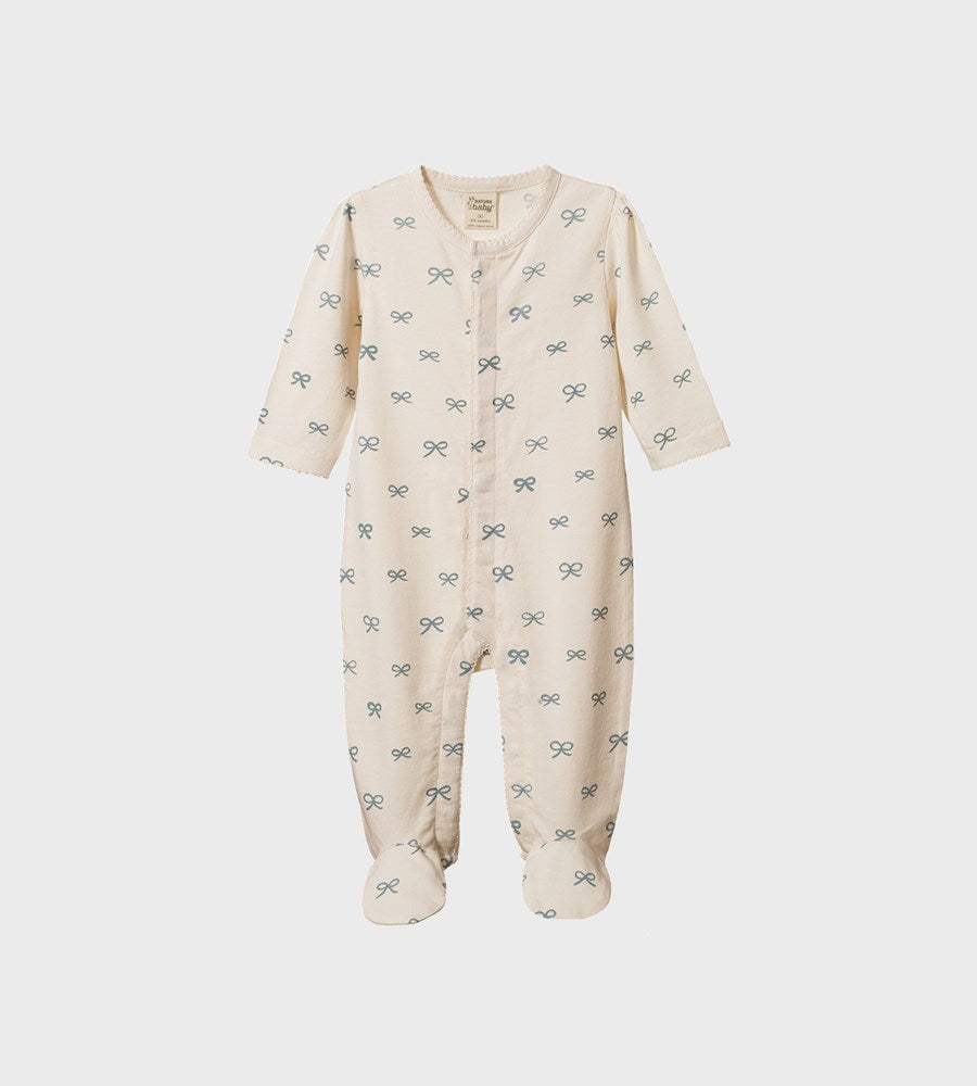 Baby onesie with bow pattern on a white background