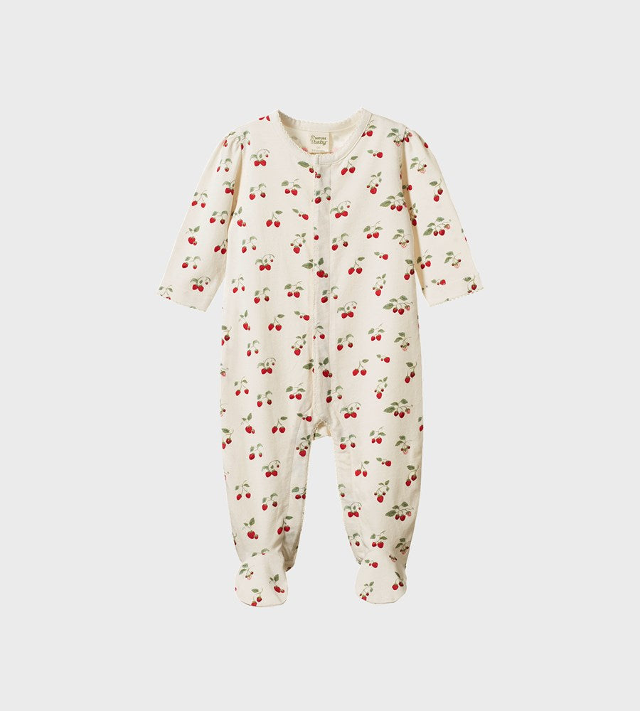 Baby onesie with cherry pattern on a white background