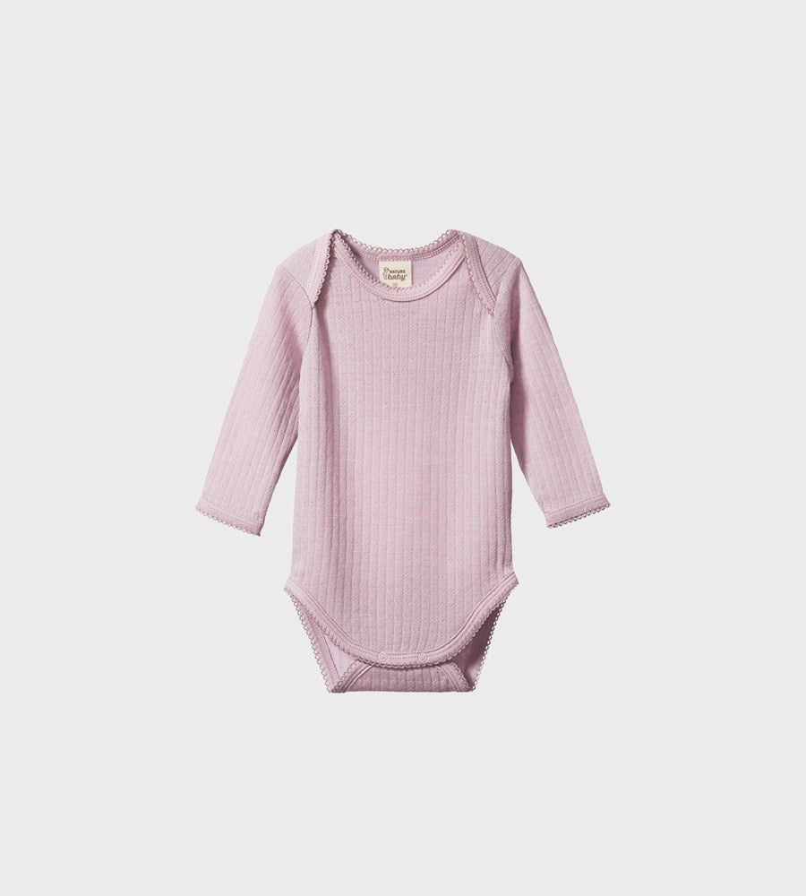 Pink baby bodysuit with long sleeves on a white background