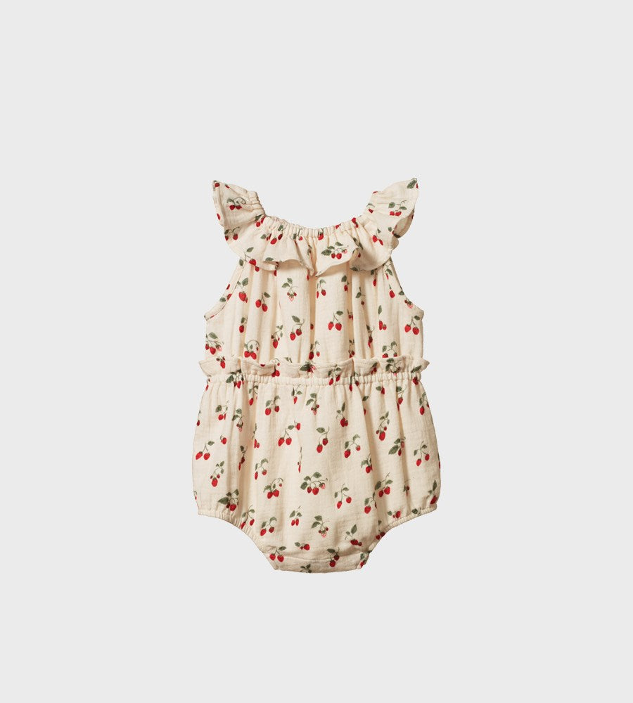 Baby romper with cherry pattern on a white background