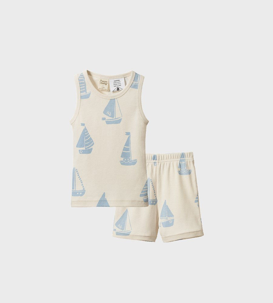 Children's sleeveless top and shorts set with sailboat pattern on a white background