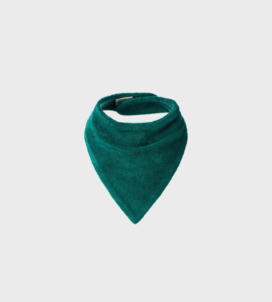 Green bib on a light gray background