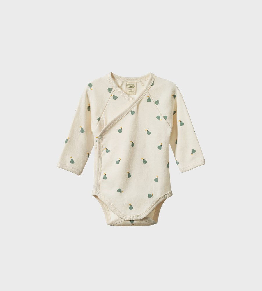 Baby onesie with long sleeves and a pattern on a white background