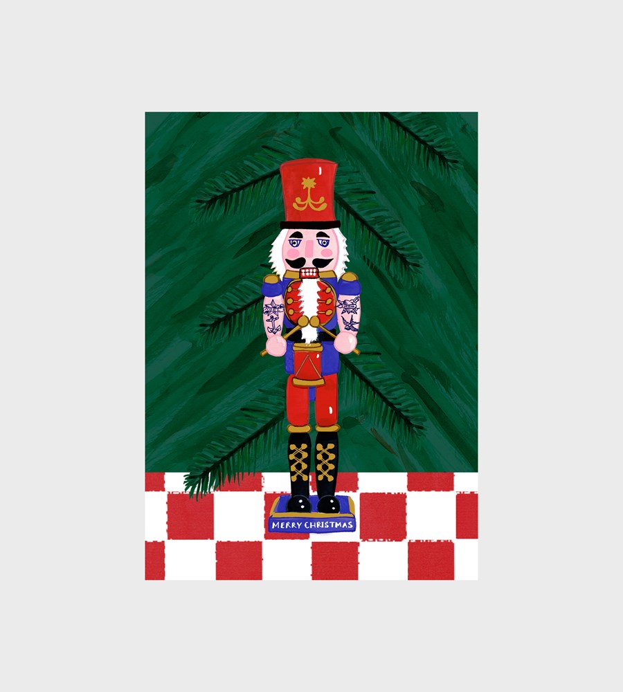 Decorative Christmas card with a nutcracker and tree on a green background