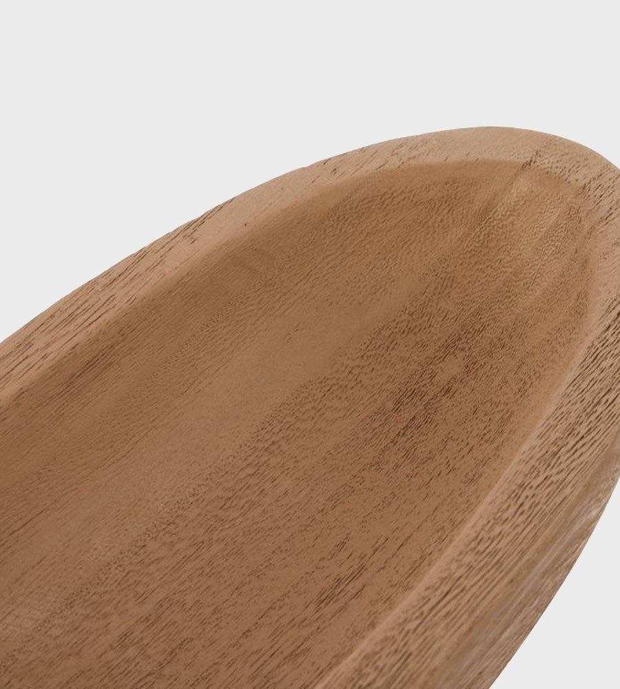 Close-up of a wooden spoon with a light brown finish on a white background
