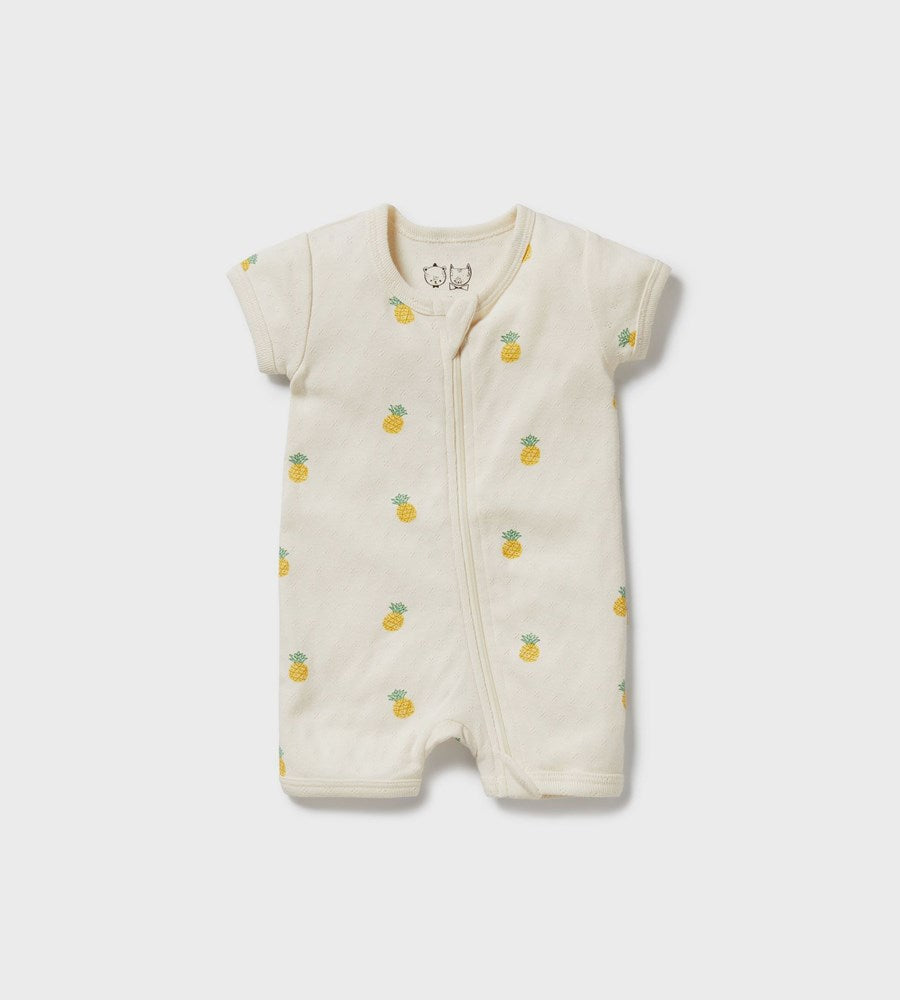 Baby romper with pineapple pattern on a white background