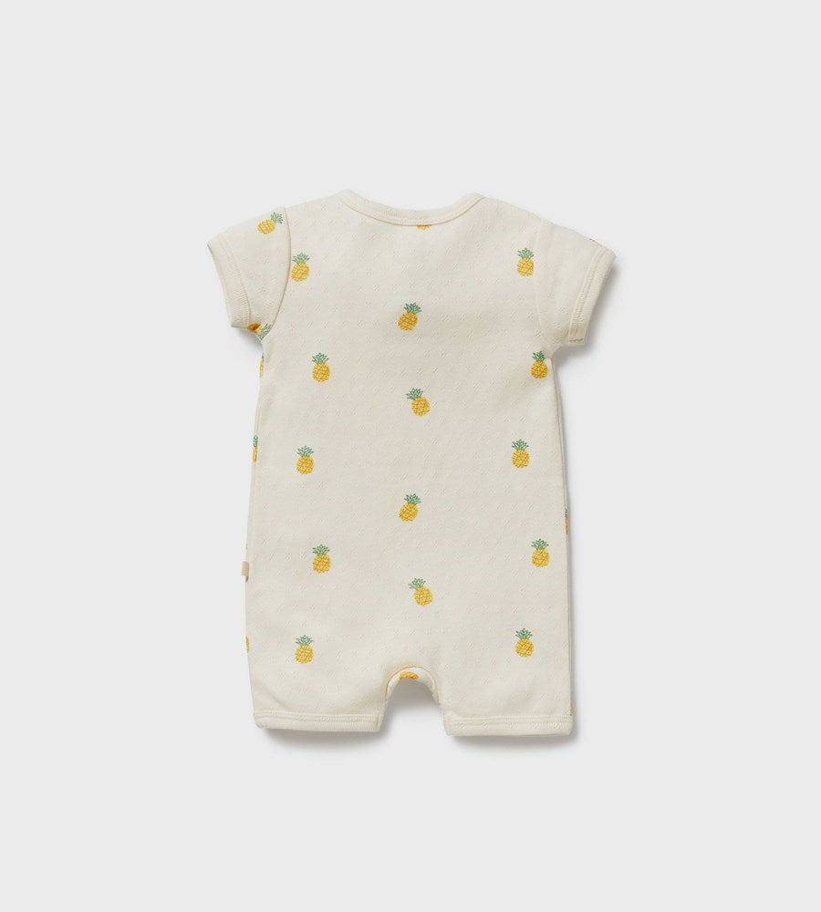 Baby romper with pineapple pattern on a white background