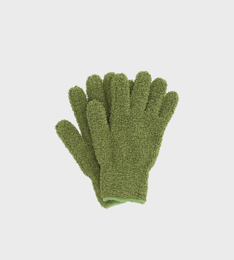 Pair of green gloves on a light gray background