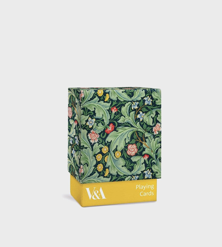 Floral-patterned playing card box with yellow base on a white background