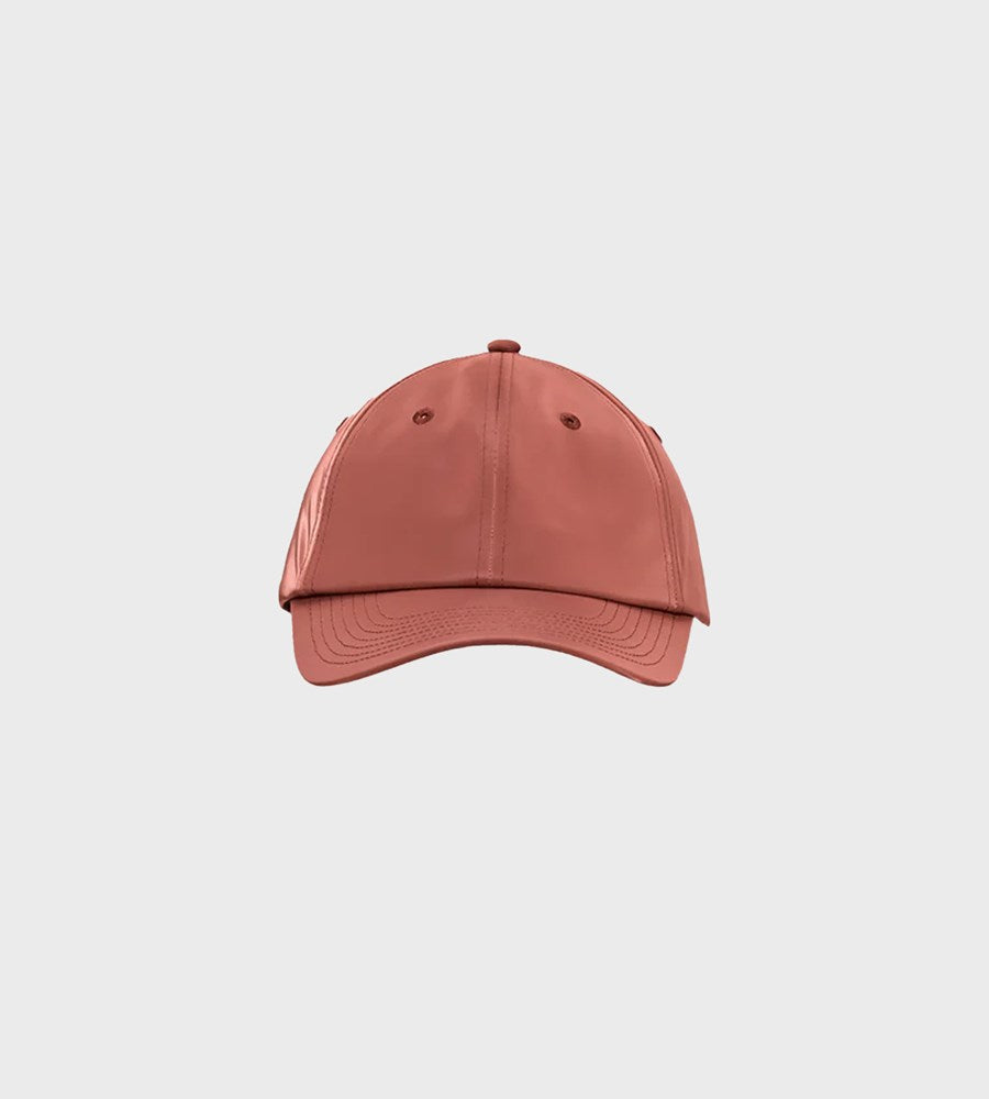 Pink baseball cap on a light gray background