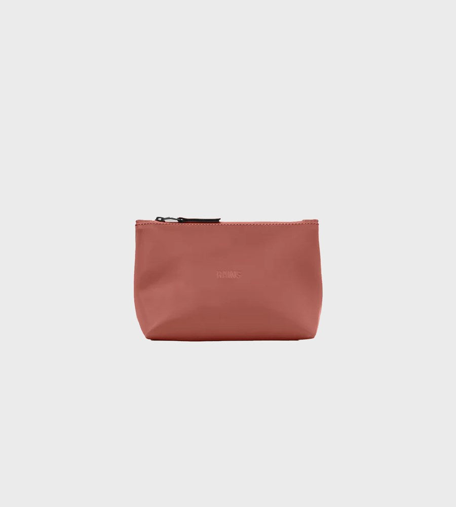 Brown pouch with a zipper on a light gray background