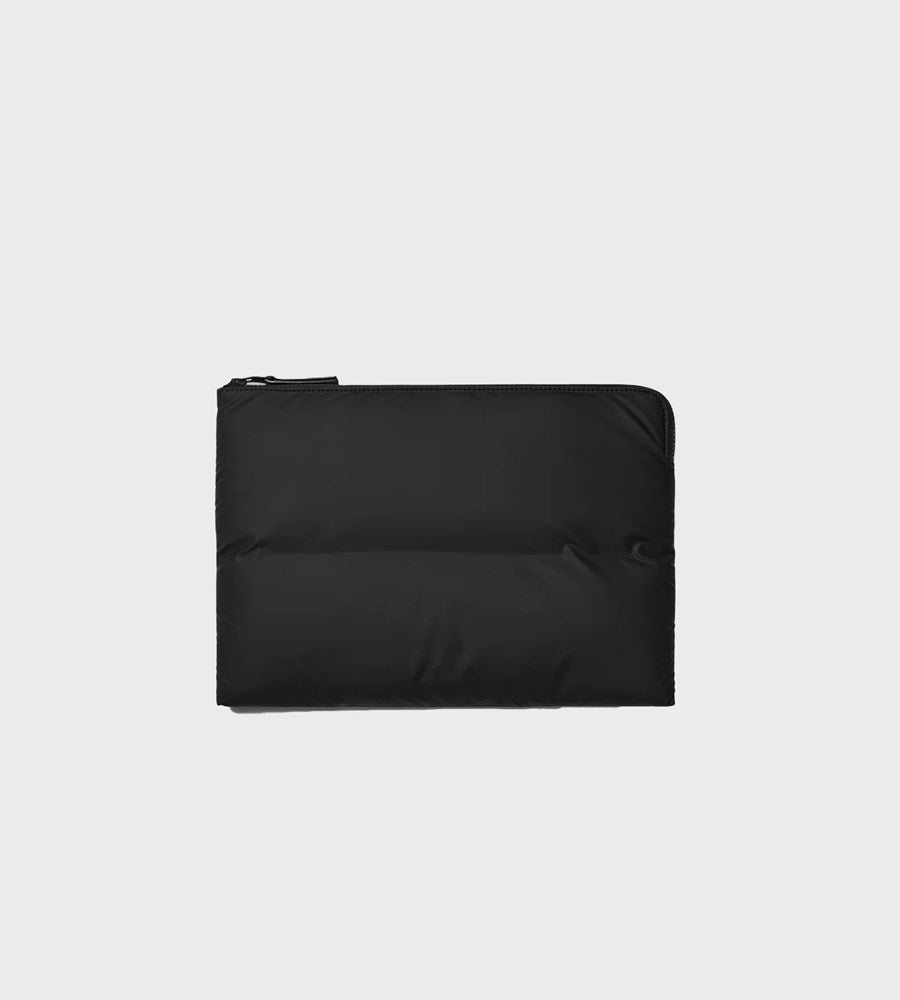 Black pouch with zipper on a light gray background