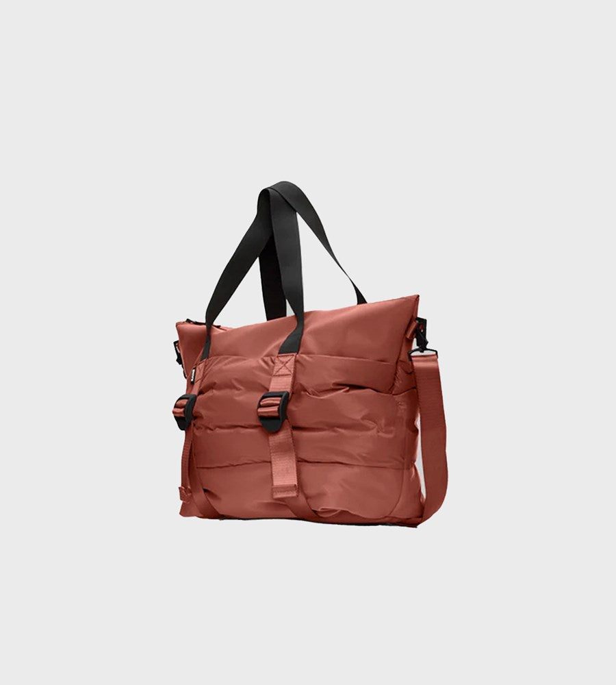 Brown tote bag with black straps on a light gray background