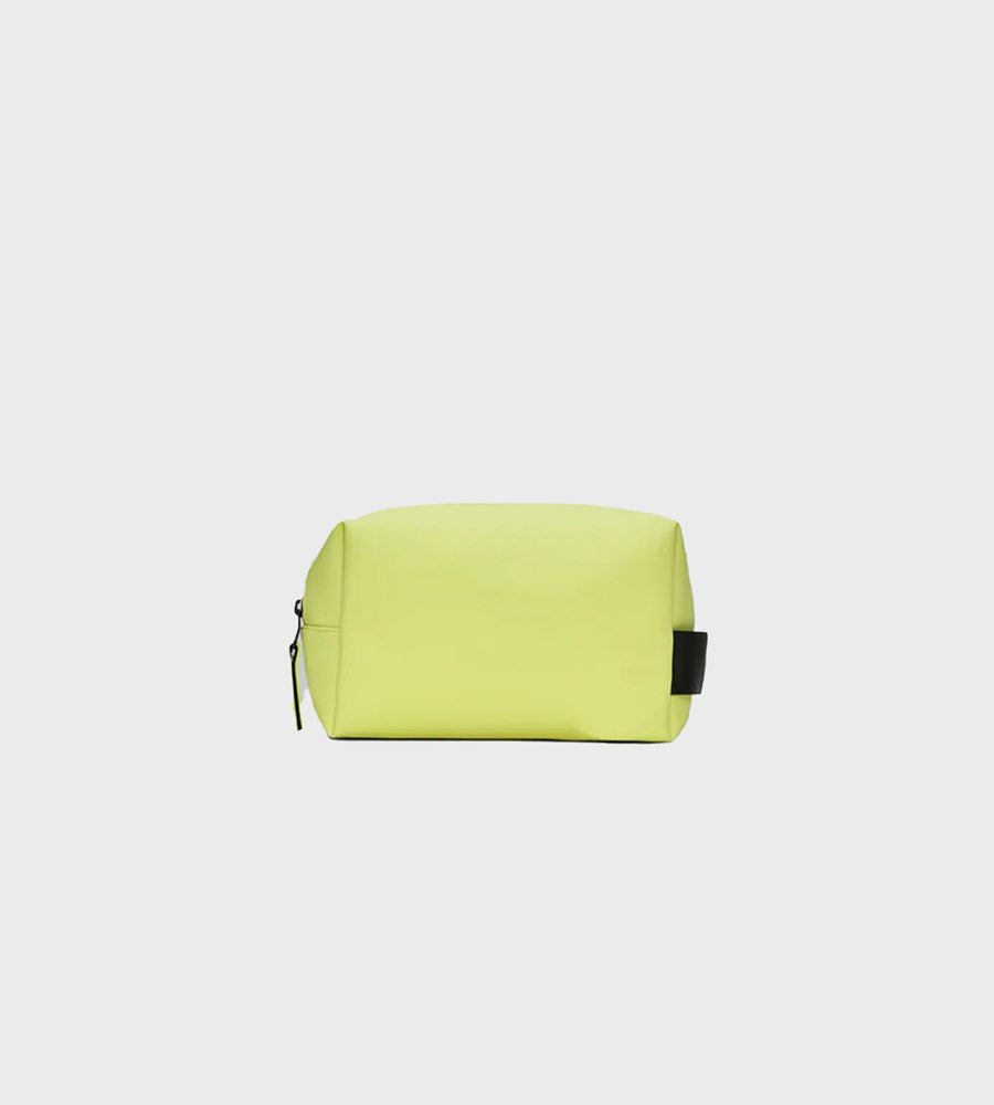 Yellow pouch with a black zipper on a light gray background
