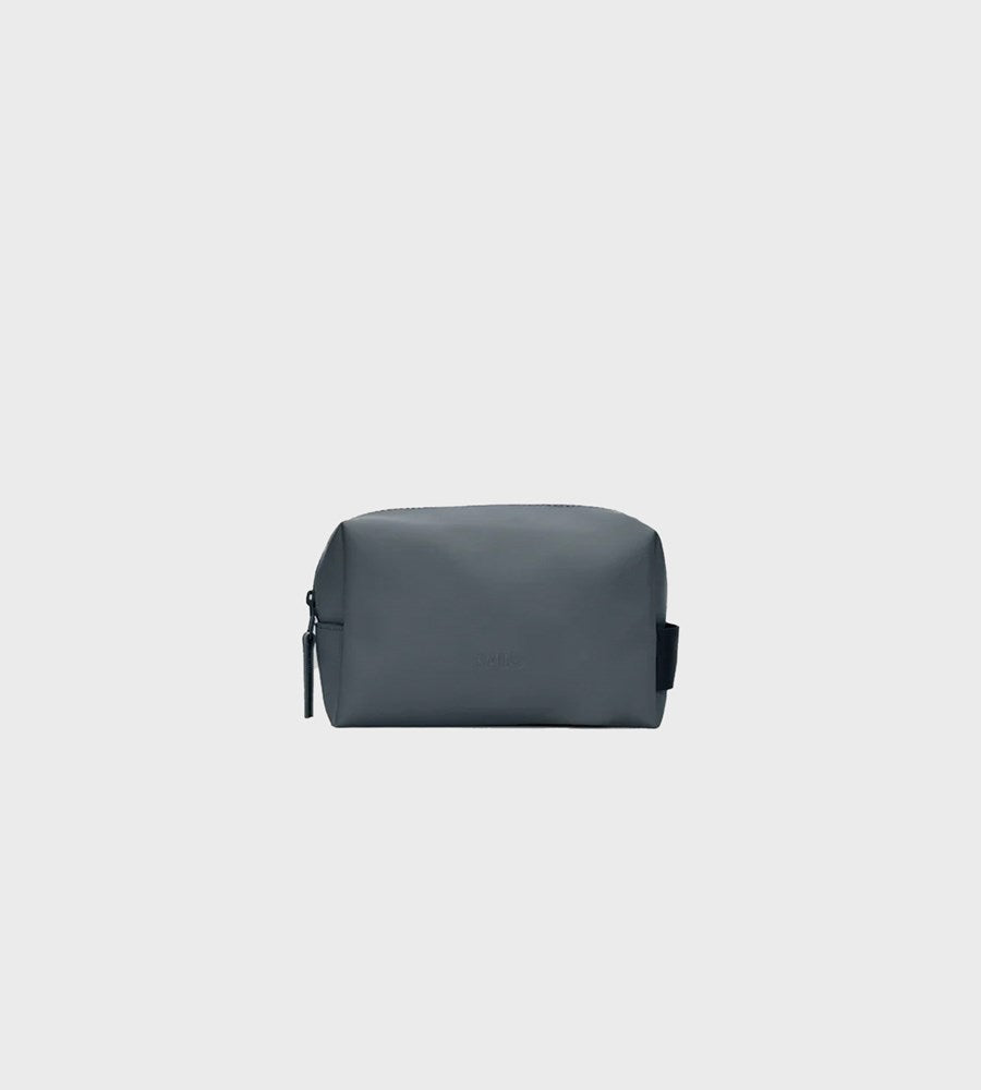 Gray toiletry bag on a light gray background
