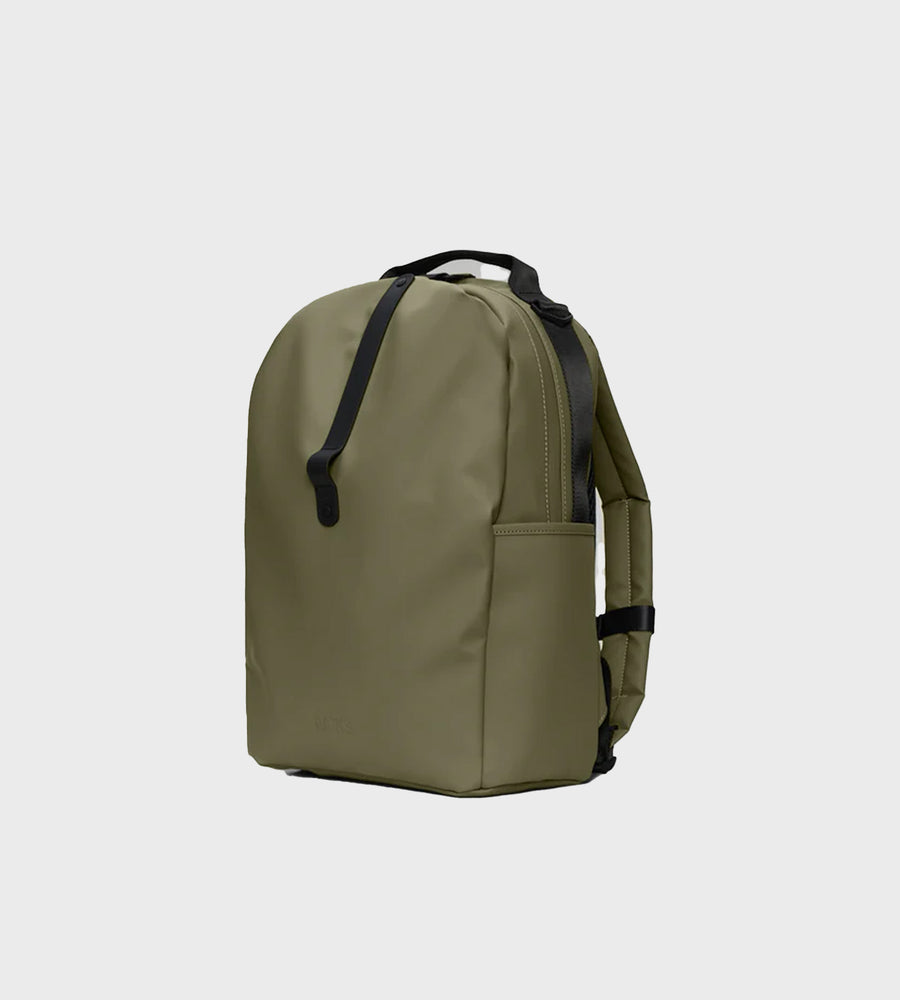 Green backpack on a light gray background