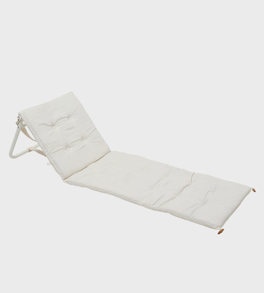 White quilted mat with handles on a light gray background