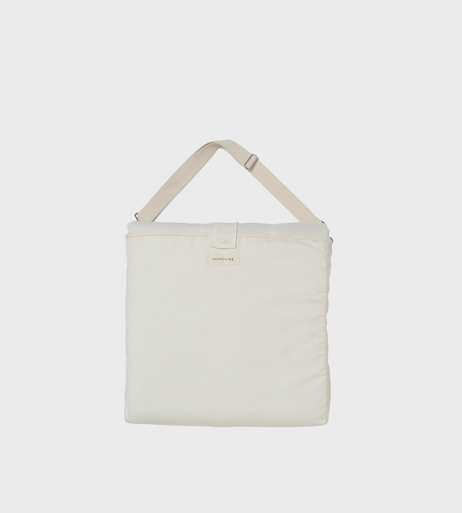 White tote bag with a strap on a light gray background