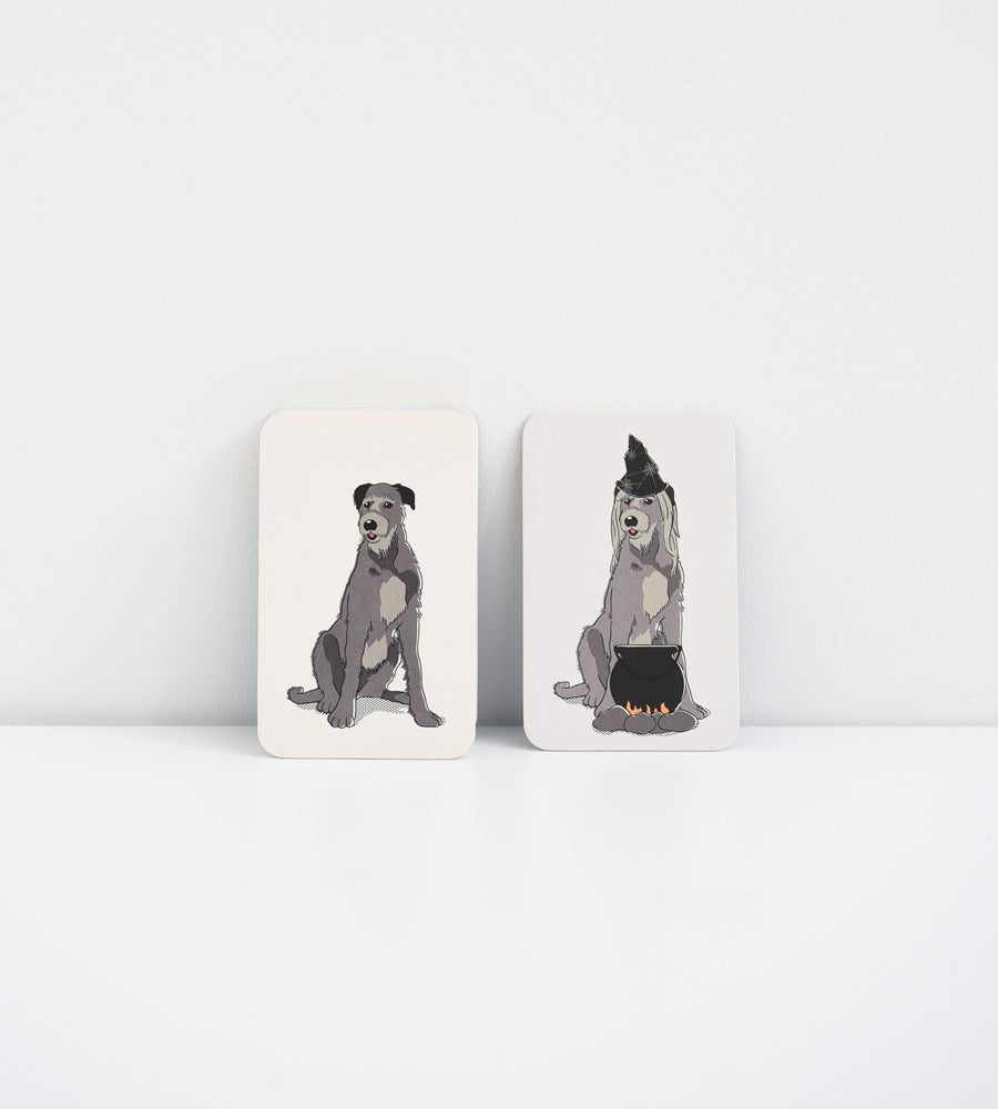 Two square coasters with dog illustrations on a white background