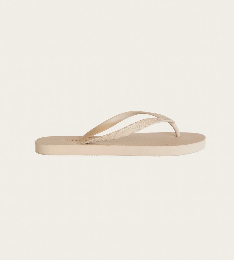 Beige flip-flop sandal on a light beige background