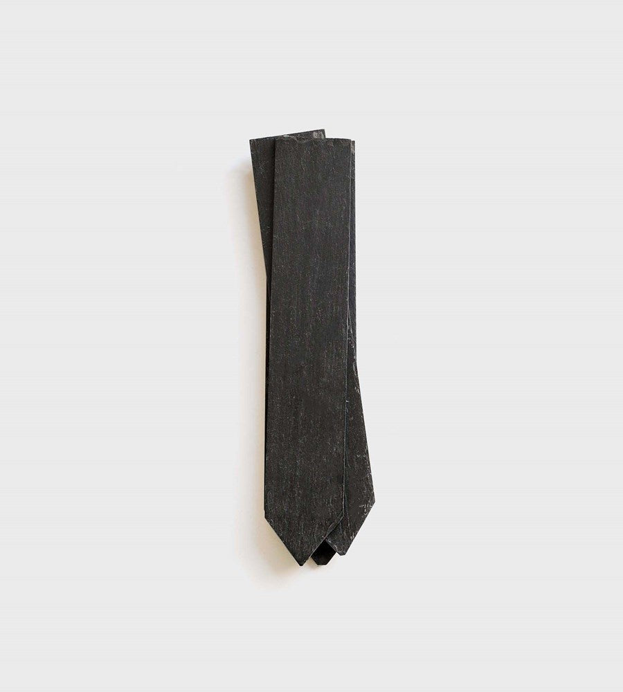 Dark gray sock on a light gray background