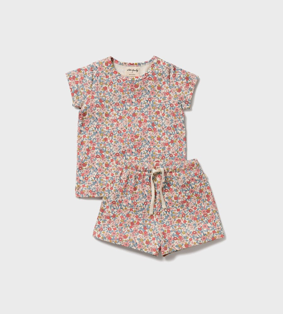 Floral children's outfit with top and shorts on a white background