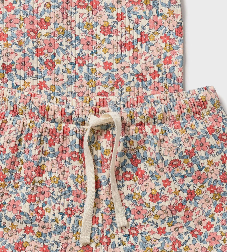 Floral patterned pants with a drawstring on a white background
