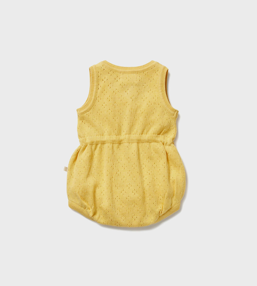 Yellow baby romper on a light gray background