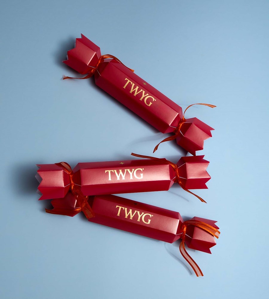 Three red TWYG wrapped items on a light blue background