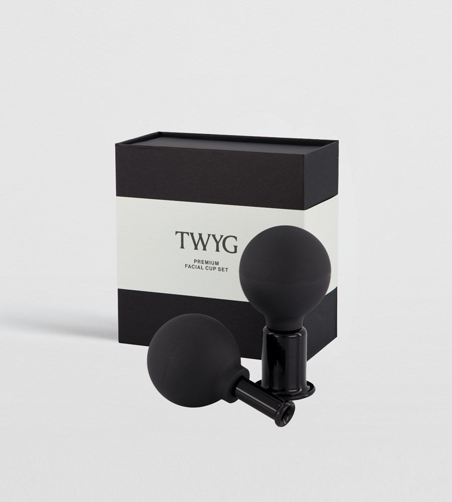 Black facial cup set with TWYG packaging on a light gray background