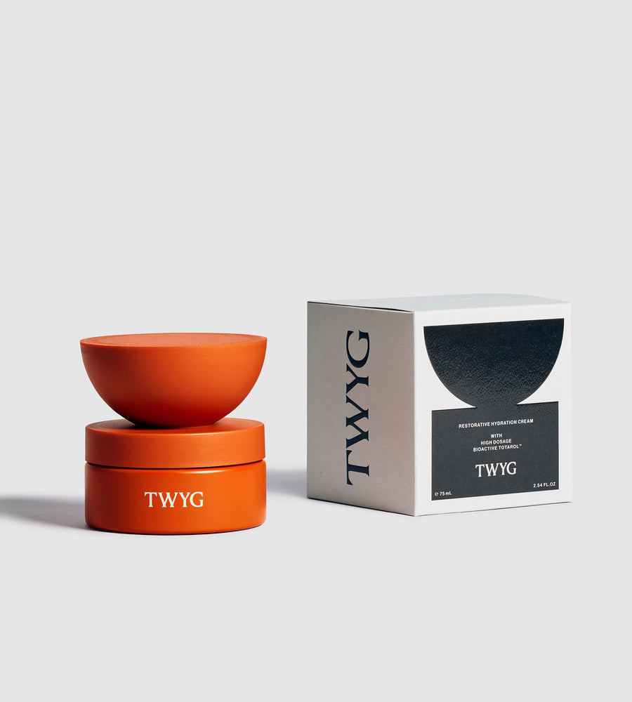 Orange TWYG product with packaging on a light gray background