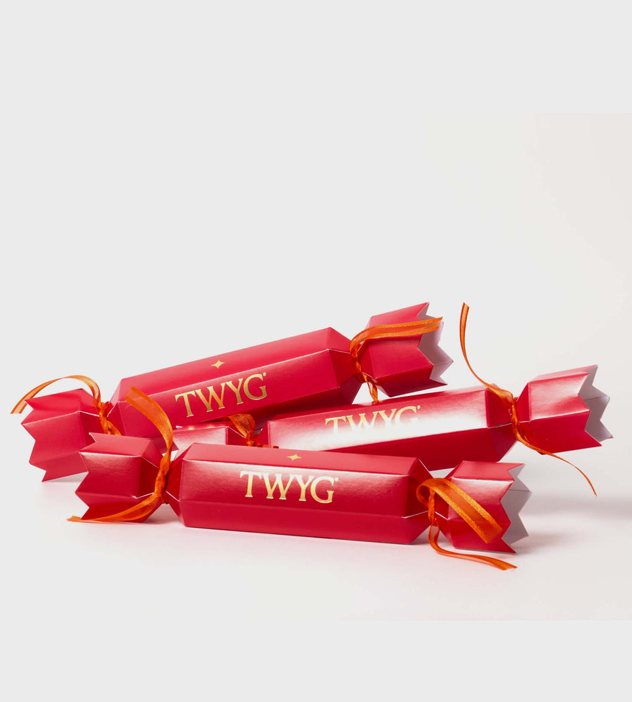 Red candy canes with orange ties and 'TWYG' branding on a light gray background