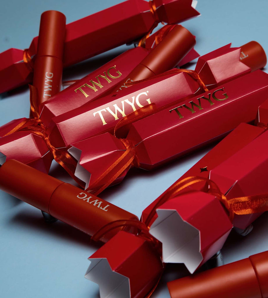 Red TWYG products with gold text on a blue background