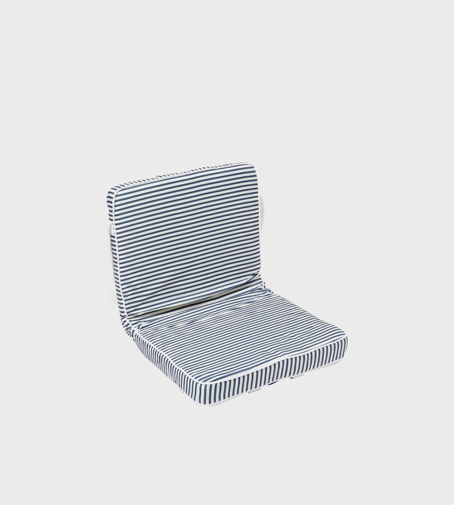 Striped chair cushion on a light gray background