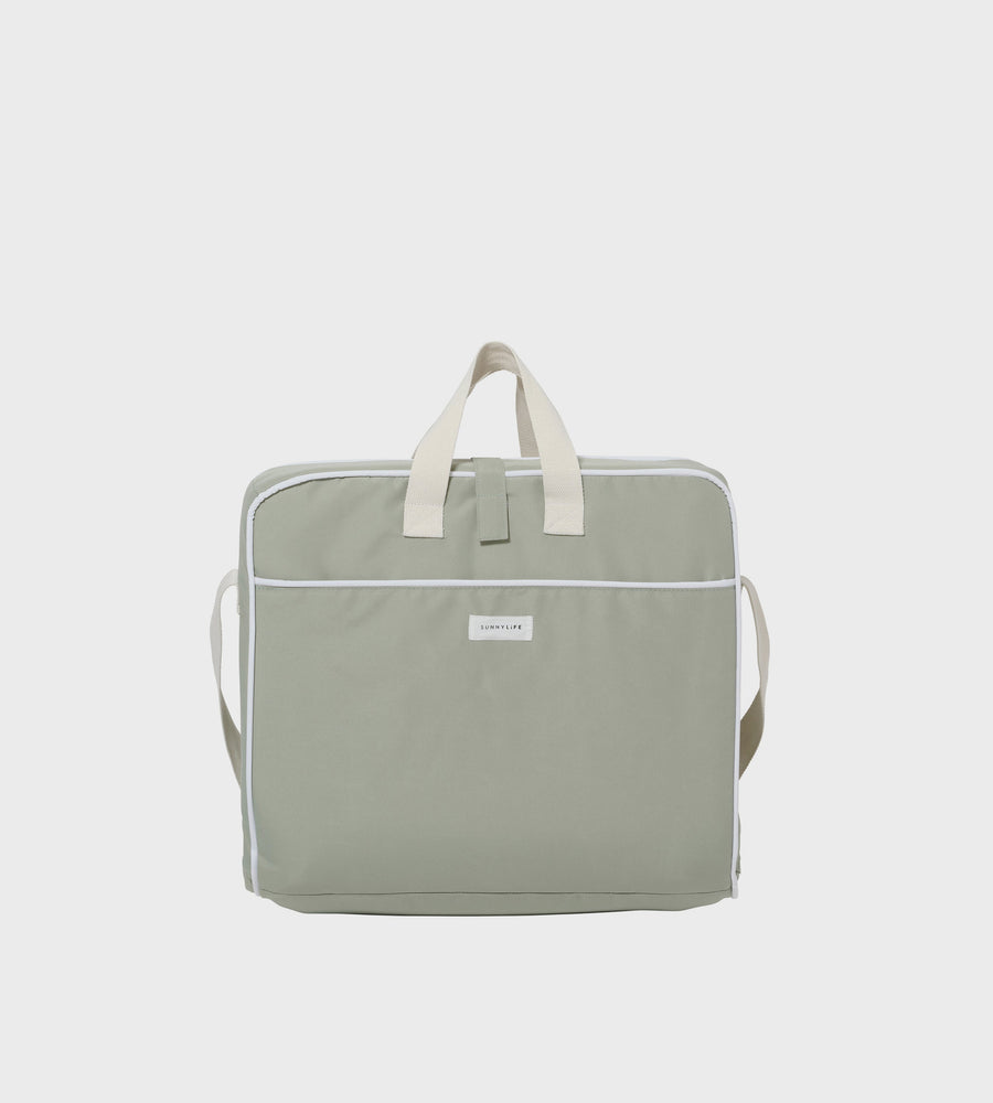 Light green tote bag with a visible brand label on a white background