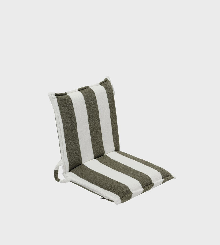 Striped chair cushion with green and white stripes on a light gray background