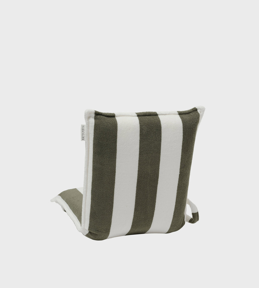 Striped pillow with green and white stripes on a light gray background