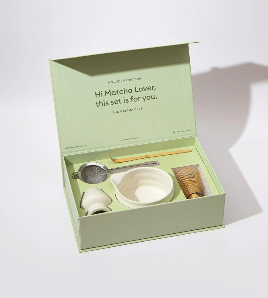 Matcha tea set with tools in a green box on a white background