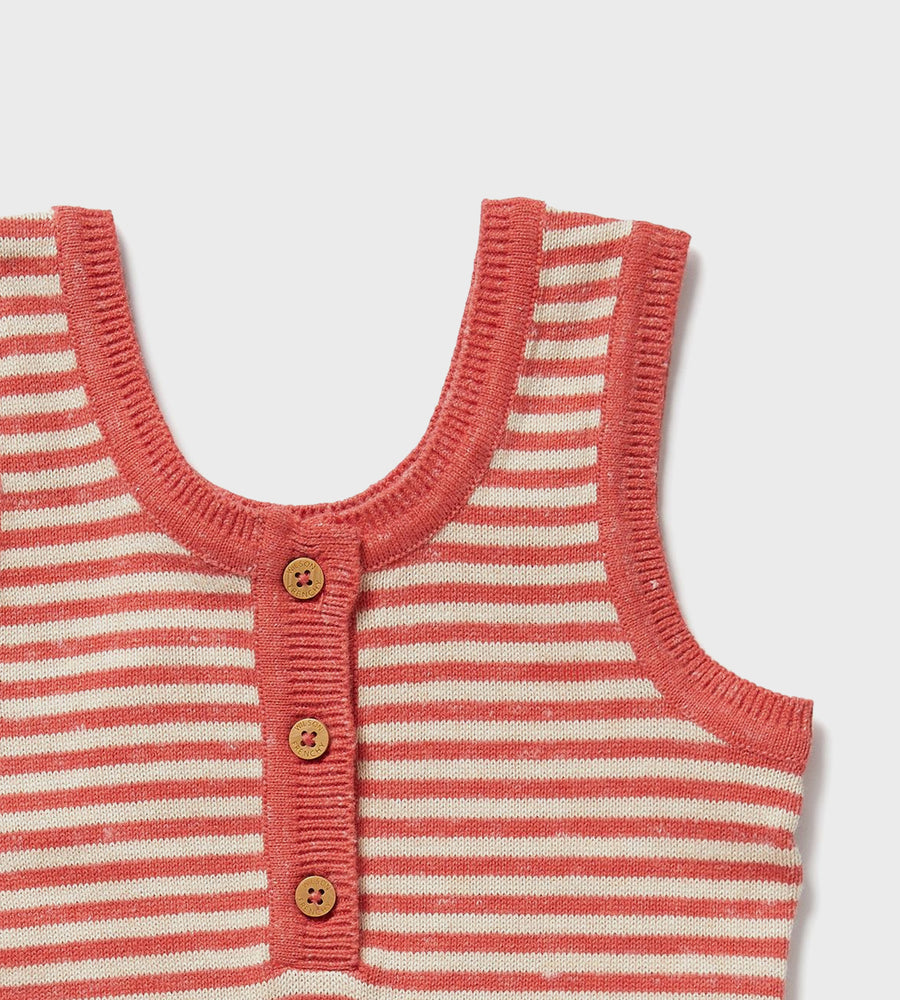 Striped baby vest with buttons on a light gray background