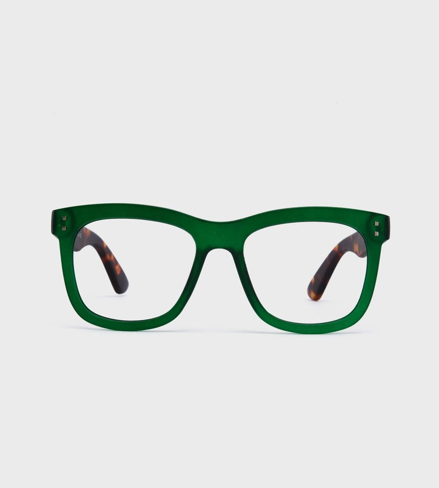 Green eyeglasses with tortoiseshell accents on a light gray background
