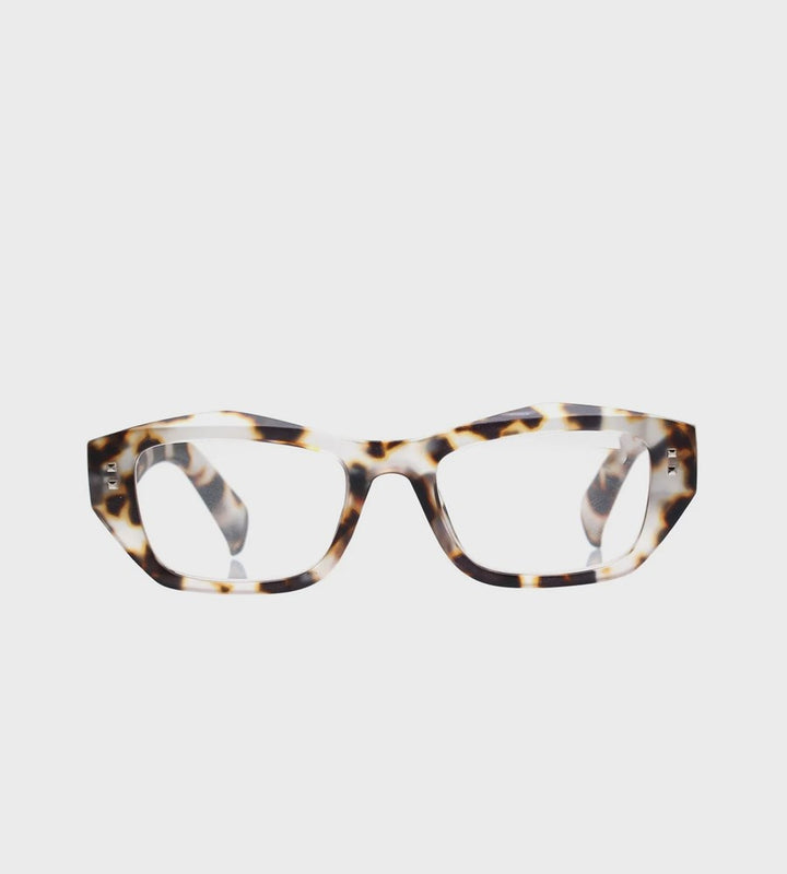 Tortoiseshell cat-eye glasses on a light gray background