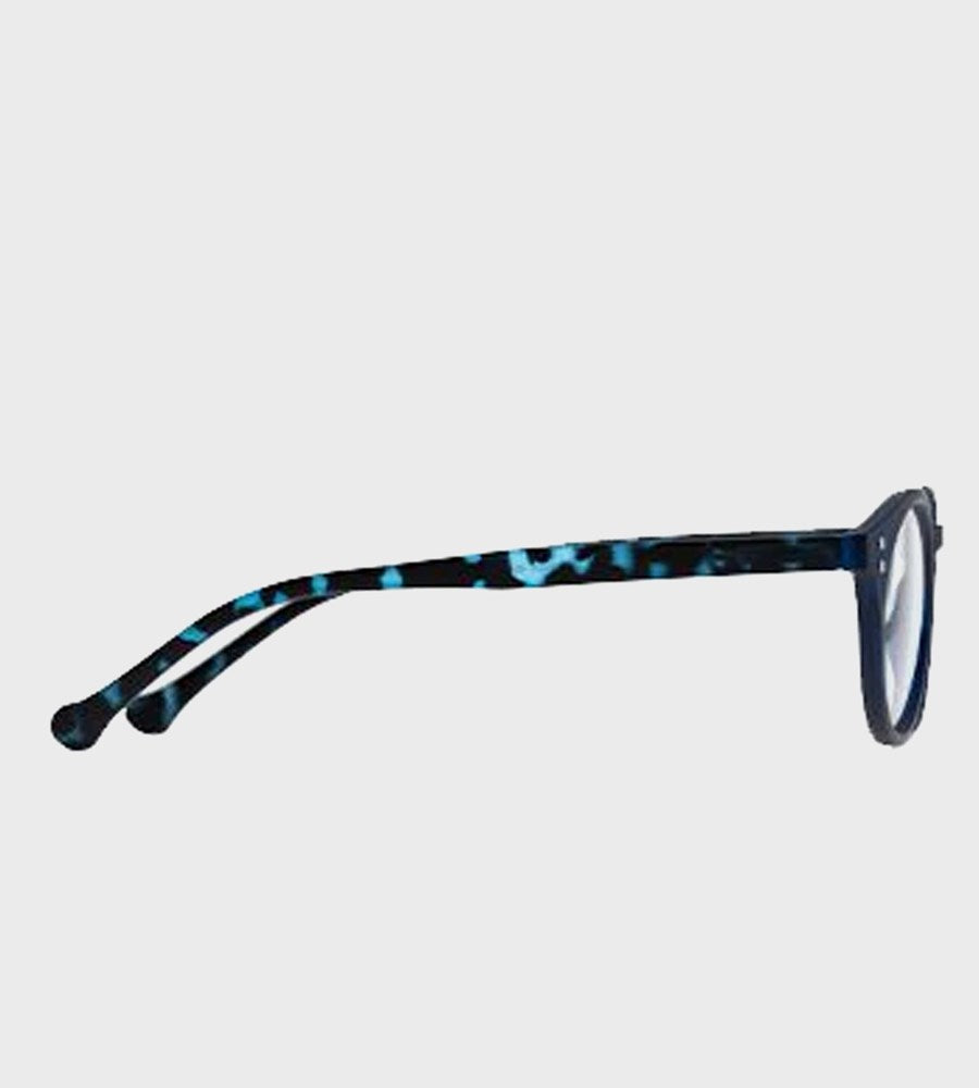 Eyeglasses with blue and black tortoiseshell frame on a light gray background
