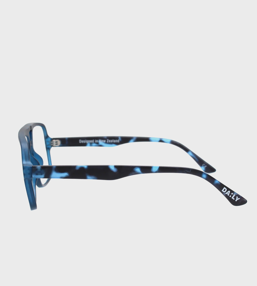 Blue and black tortoiseshell glasses on a white background