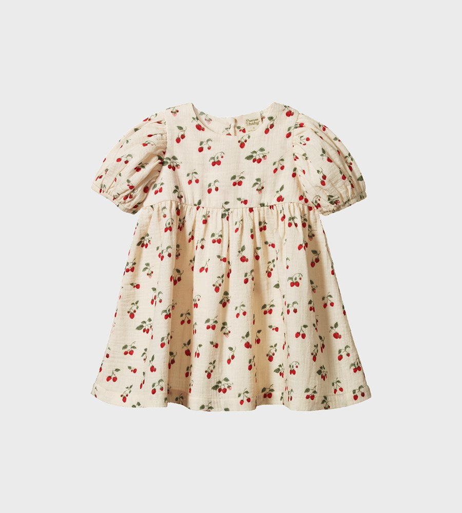 Children's dress with strawberry pattern on a light gray background