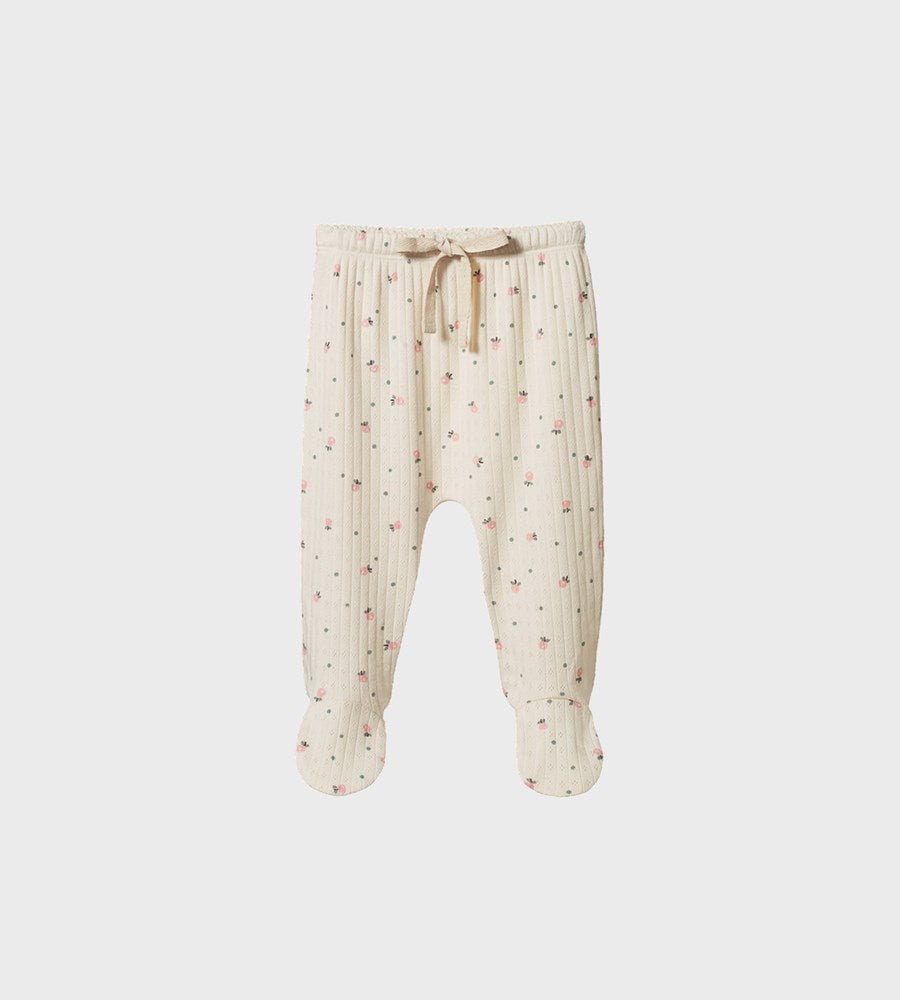 Beige baby pants with a subtle pattern on a white background