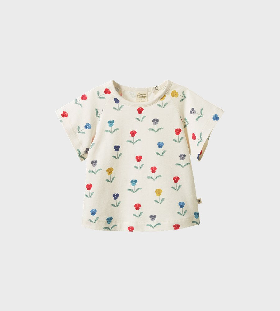 Baby dress with floral pattern on a white background